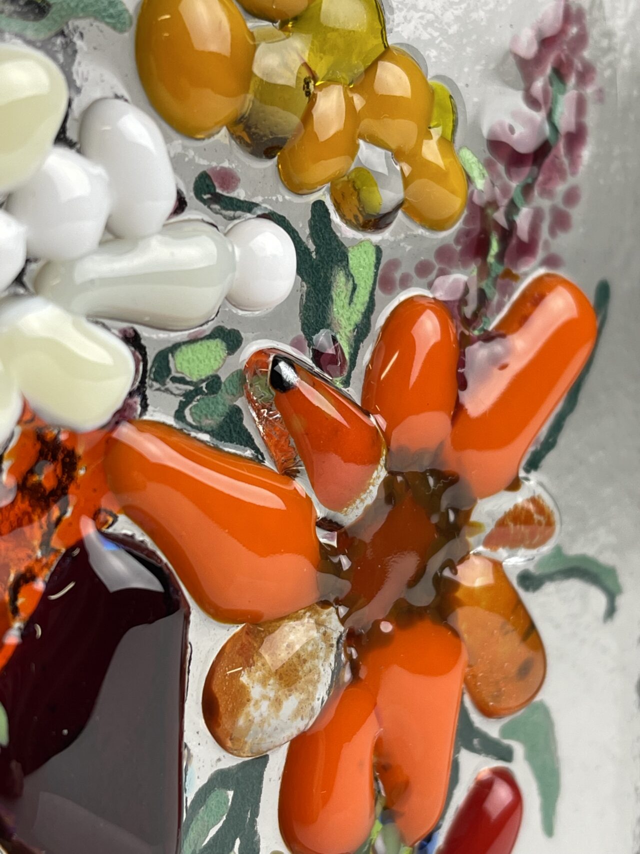 Fused Glass tile of a flower made at Kinki Glass Workshops